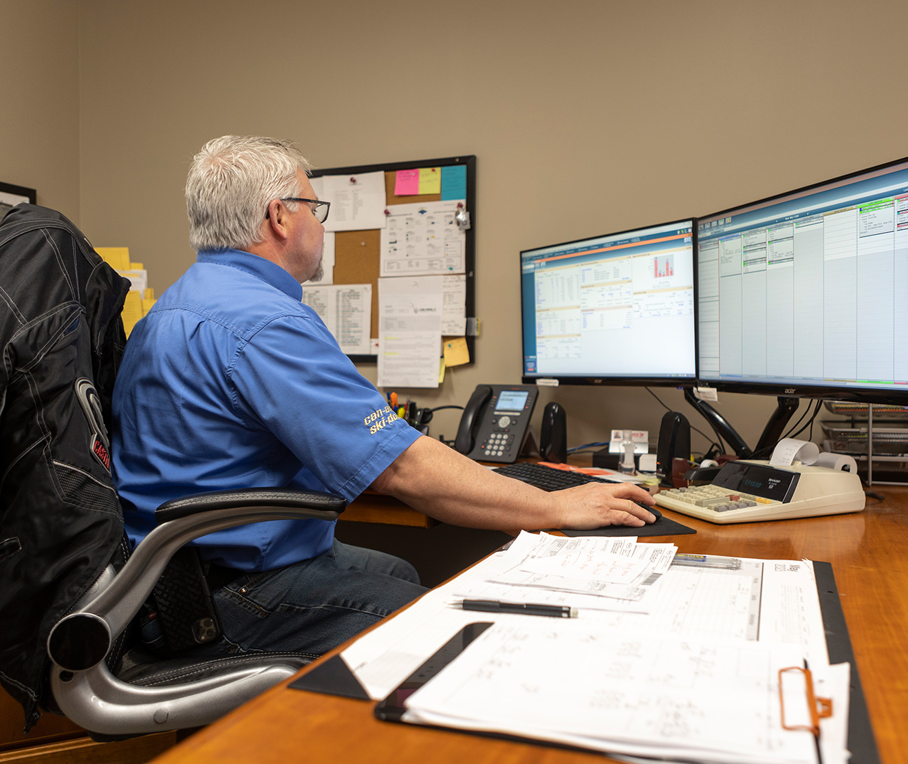 RV dealer working on accounting software on a computer.